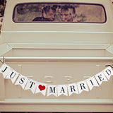 Just married bunting banner flags with ribbon, decoration wedding feast or photo booth photography